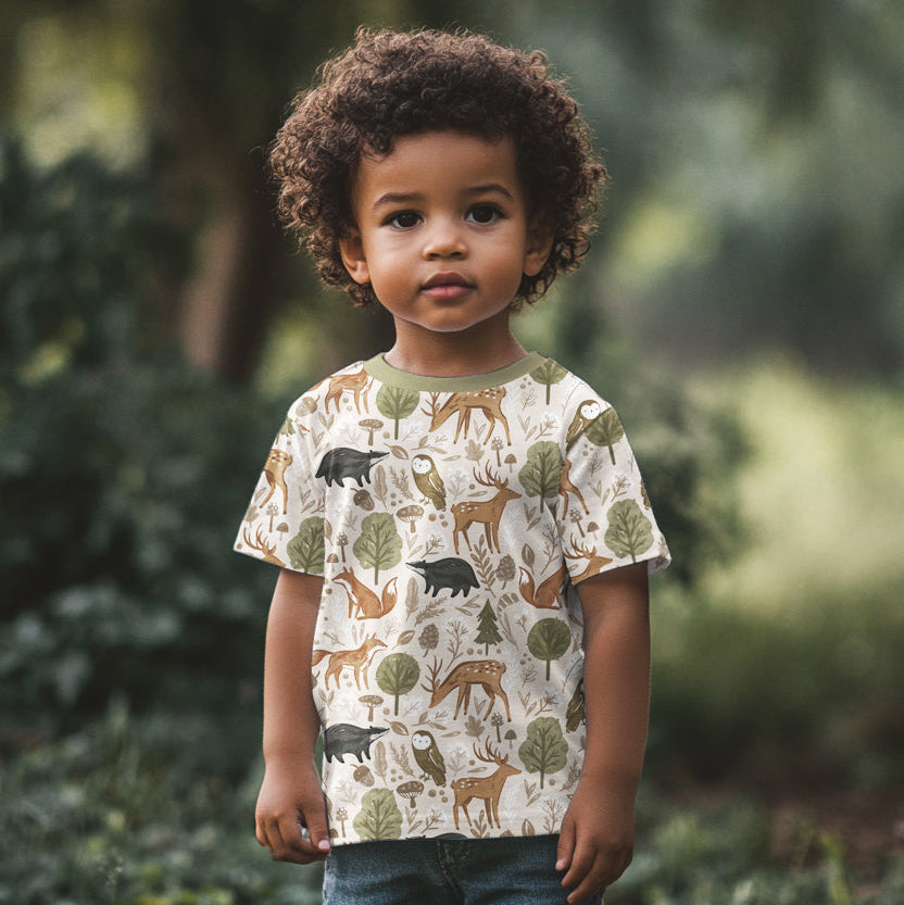 Kindersweat vom Meter in Naturtönen mit Tiermotiven – Fuchs, Eule, Dachs und Pilze auf weich angerauter Rückseite.