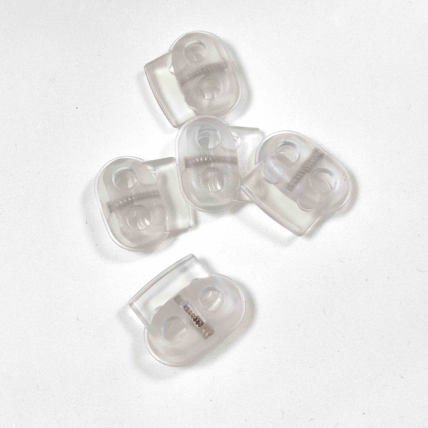 Kordelstopper 2- Loch - transparent, oval