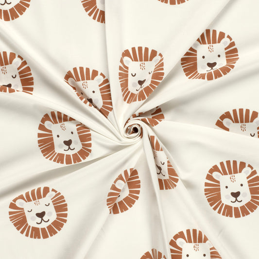 Kinderjersey mit Löwenköpfen, teils mit offenen, teils mit geschlossenen Augen. Weicher, elastischer Stoff für Kindermode.