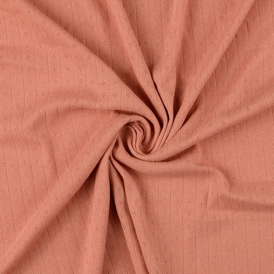 Pointoille Baumwolljersey in apricot mit feinem Lochmuster