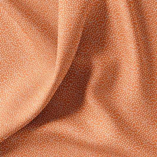 Baumwollstoff mit unregelmäßigen kleinen Pünktchen, orange
