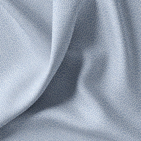 Baumwollstoff mit unregelmäßigen kleinen Pünktchen, hellblau