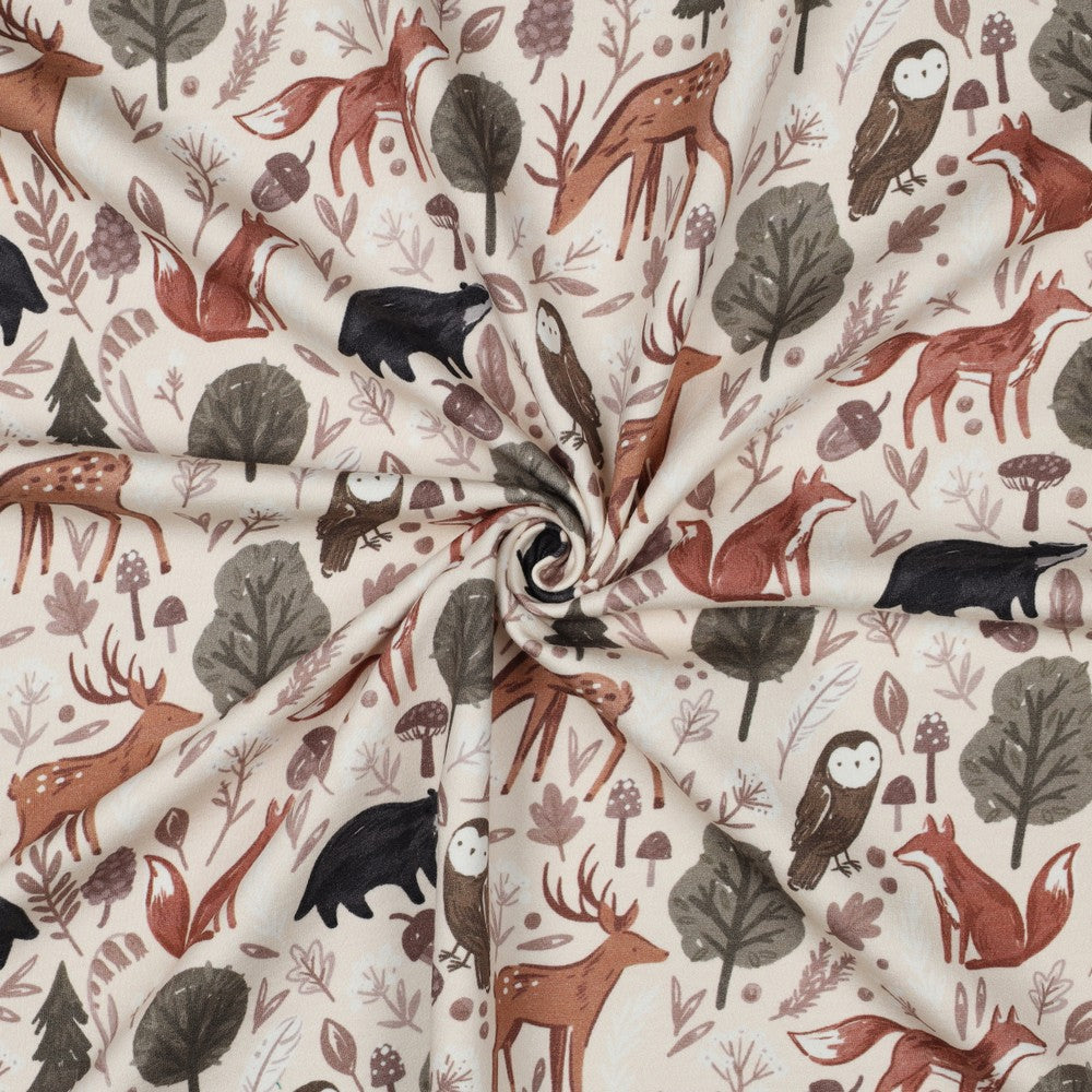 Kindersweat vom Meter in Naturtönen mit Tiermotiven – Fuchs, Eule, Dachs und Pilze auf weich angerauter Rückseite.