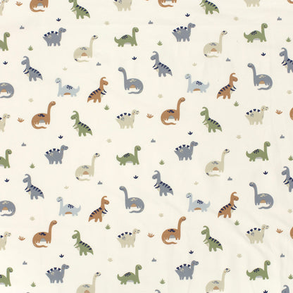 Kinderjersey mit kleinen Dinosauriern. Weicher, elastischer Stoff für Kindermode wie Shirts, Hosen, Kleider und Schlafanzüge.