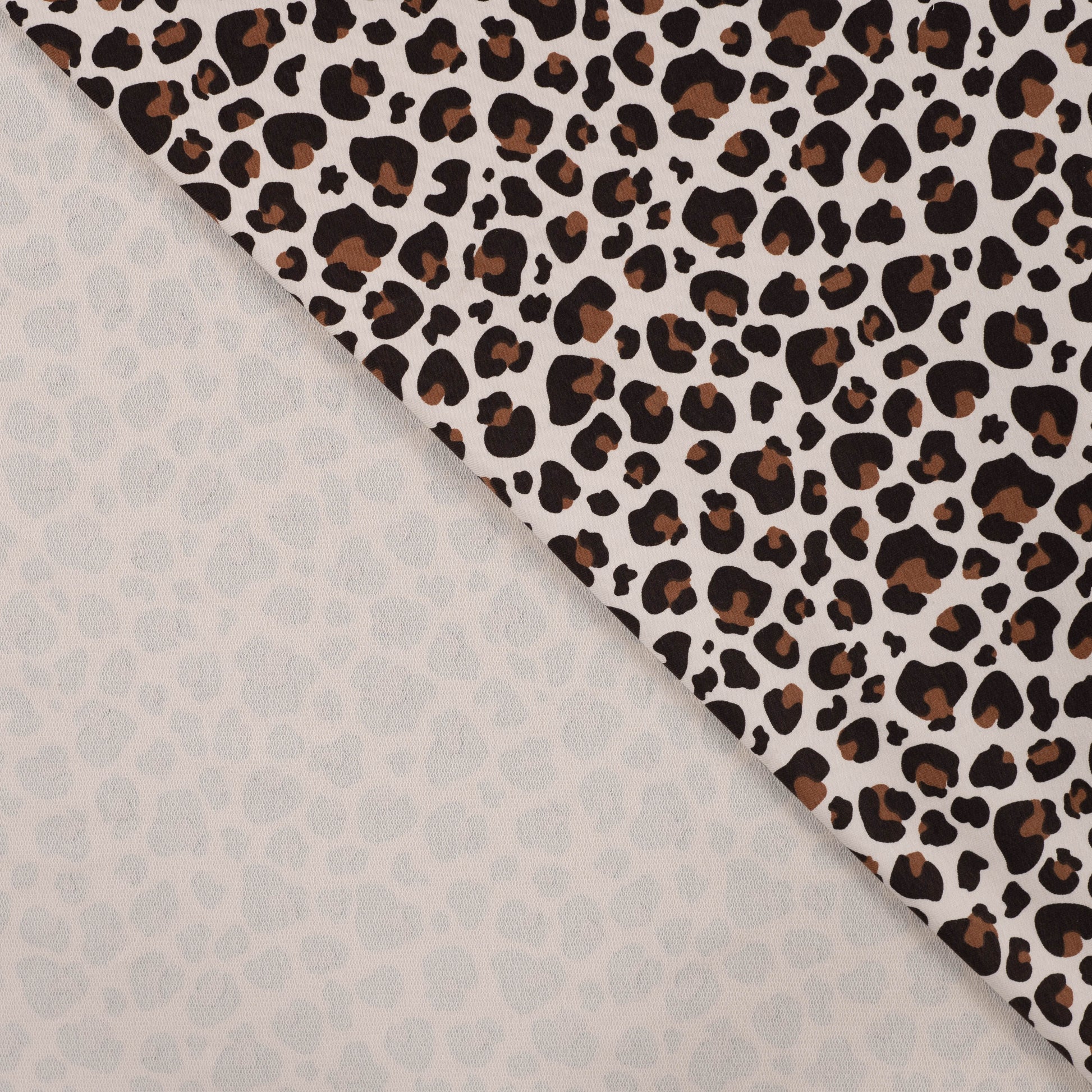 French Terry mit Leomuster – Baumwollstoff, außen glatt, innen mit Schlaufen, ideal für Kleidung.