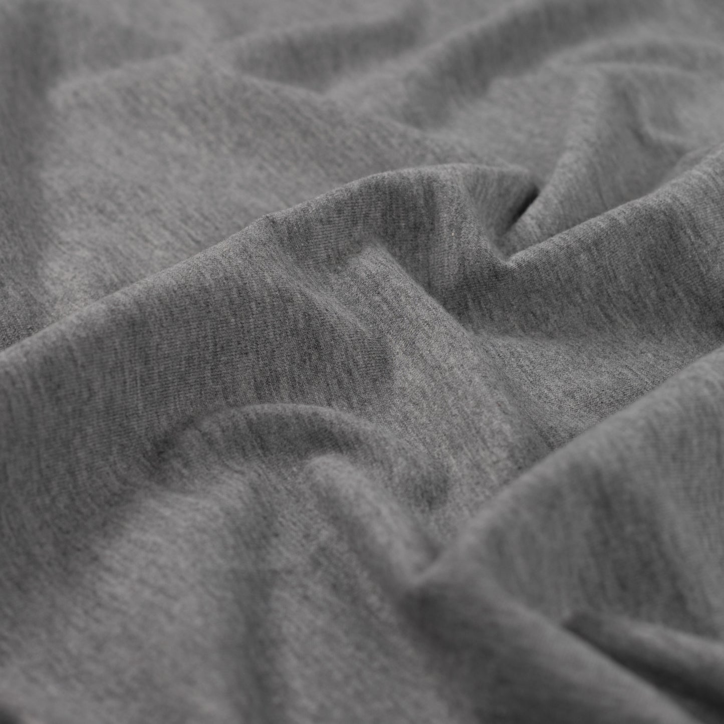 French Terry Stoff in Melange-Optik, leichter Sweatstoff mit Schlingenrückseite. Weich, elastisch und ideal für Shirts, Hoodies, Hosen und Kinderkleidung.