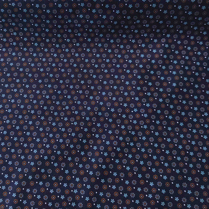Dunkelblauer Feincord von Kokka mit kleinen Blüten in Hellblau, Rost und Creme aus 100 % Baumwolle.