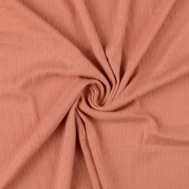 Pointoille Baumwolljersey in apricot mit feinem Lochmuster