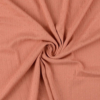 Pointoille Baumwolljersey in apricot mit feinem Lochmuster