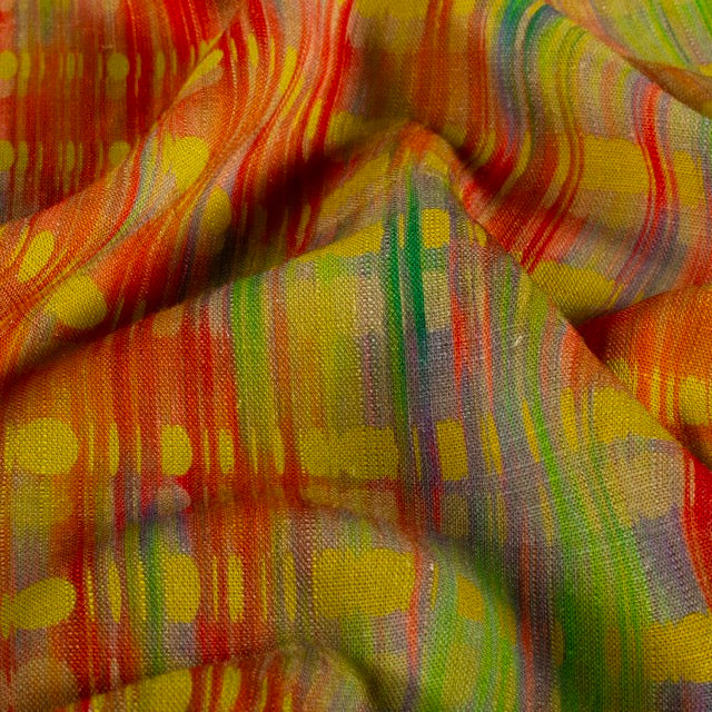 Viskose-Leinen Stoff mit buntem abstraktem Muster in Orange, Gelb, Grün und Rot.