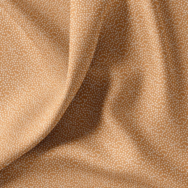 Baumwollstoff mit unregelmäßigen kleinen Pünktchen, ockerbraun