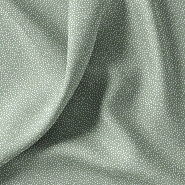 Baumwollstoff mit unregelmäßigen kleinen Pünktchen, grün