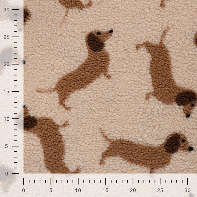 Teddy Jacquard mit braunen Dackeln auf cremefarbenem Grund