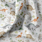 Fall und Muster des Dinosaurierstoffs in Grün und Beige